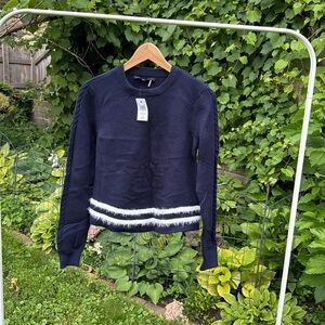Navy sweater with white angora stripes.